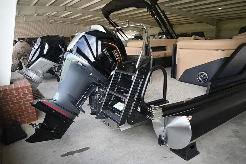Slide: The Image of 2026 Evotti 523QL boat with powerful outboard motor in a covered storage area. - 5