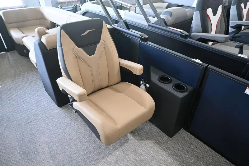 Slide: The Image of Luxurious beige seating in 2026 Evotti 523QL boat interior with cup holders. - 9