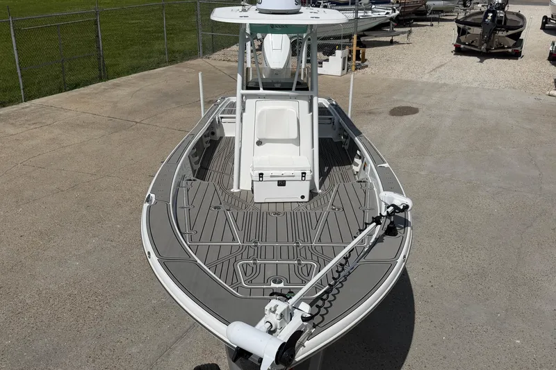 Slide: The Image of 2024 BlackJack 256 Bay boat with sleek design, docked on concrete surface. - 11