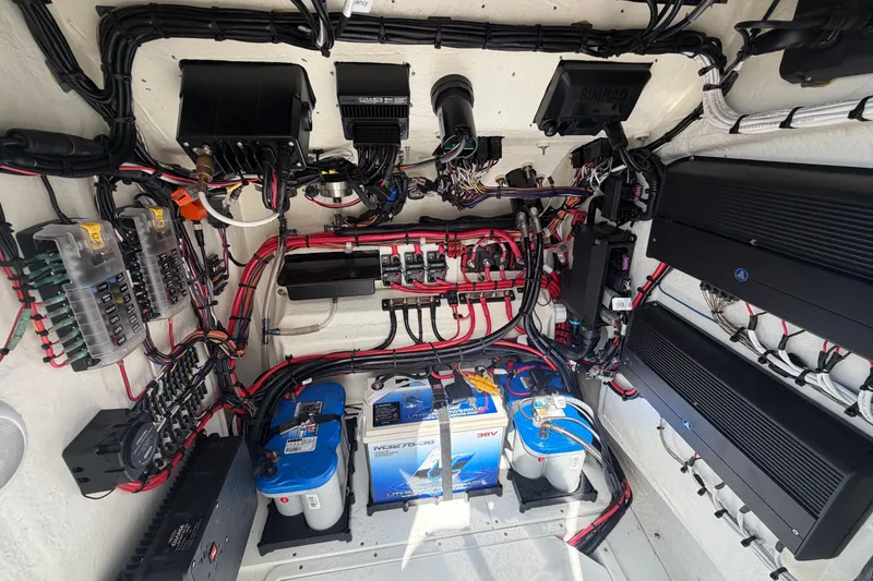 Slide: The Image of 2024 BlackJack 256 Bay boat electrical system with batteries and wiring. - 20