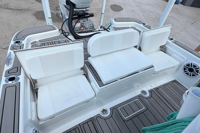 Slide: The Image of 2024 BlackJack 256 Bay boat with white seating and deck details. - 28