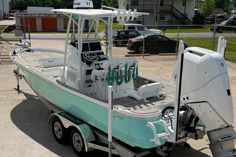 Slide: The Image of 2024 BlackJack 256 Bay boat on trailer, featuring sleek design and modern equipment. - 6