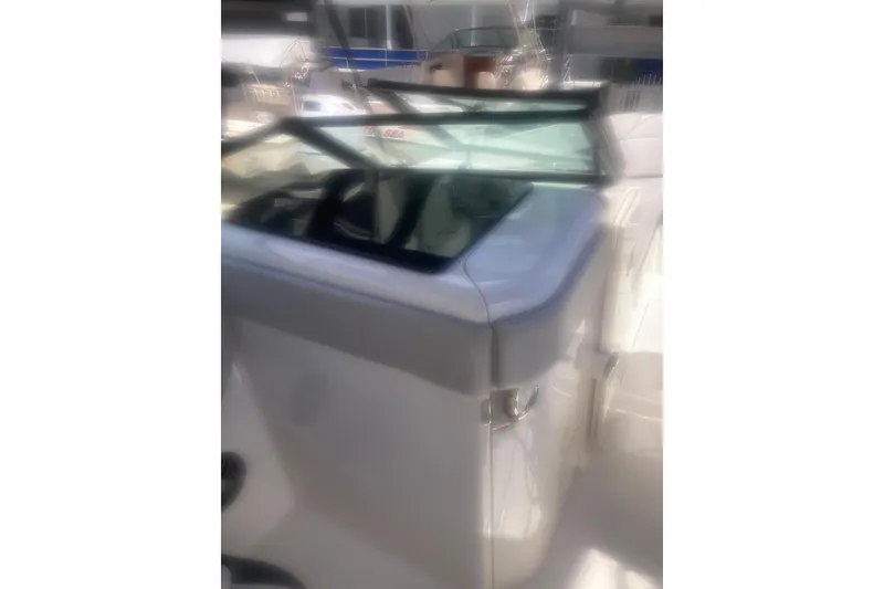 Slide: The Image of 2022 Sea Ray SPX 230 Outboard boat interior with seating and windshield. - 15