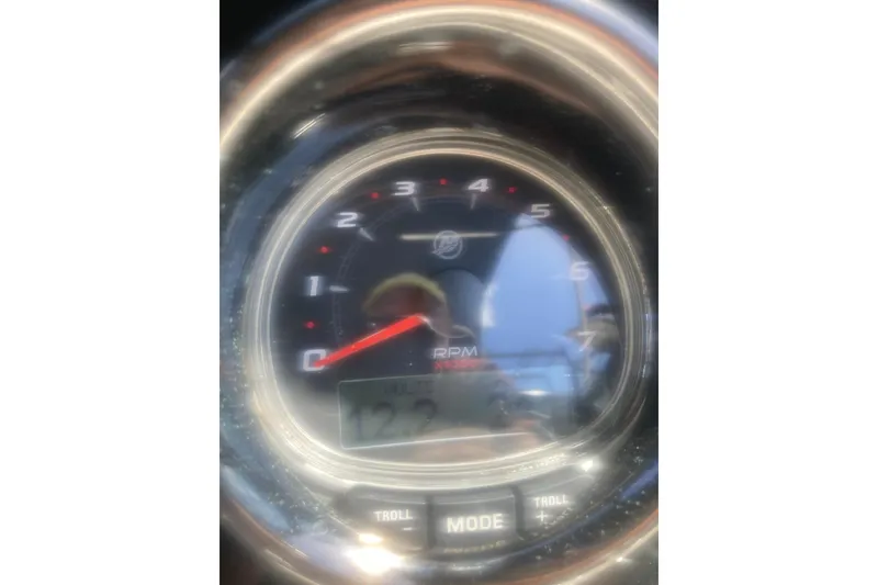 Slide: The Image of Interior view of 2022 Sea Ray SPX 230 Outboard boat cockpit with steering wheel. - 18