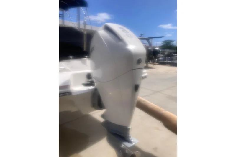 Slide: The Image of 2022 Sea Ray SPX 230 Outboard boat with "Popi Time" text, docked under clear skies. - 5