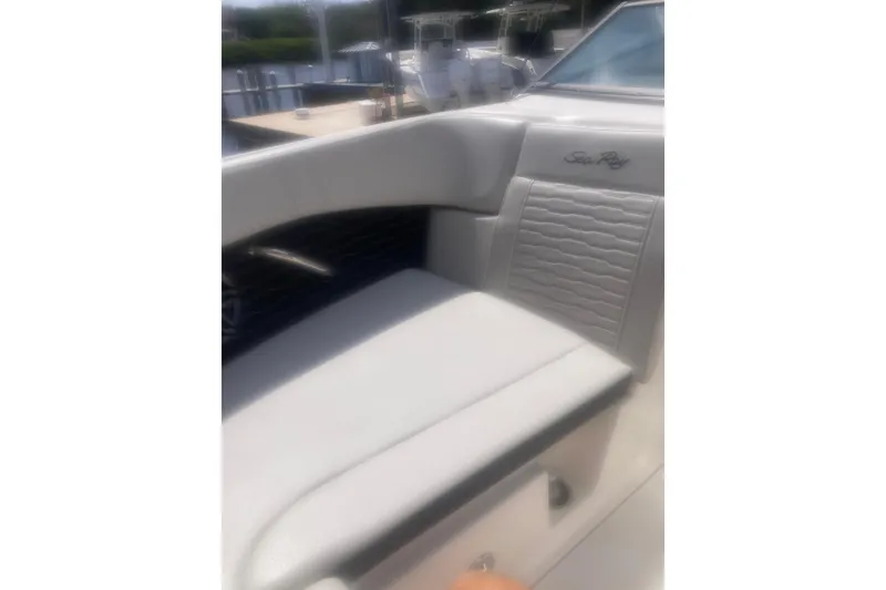 Slide: The Image of 2022 Sea Ray SPX 230 Outboard with Mercury 200 engine, docked outdoors. - 9