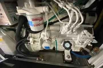 Slide: The Image of 1982 C @ L Sea Ranger engine compartment with Lugger components and hydraulic lines. - 104