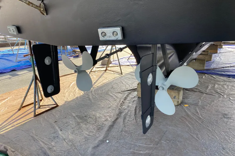 Slide: The Image of Propellers and rudders of a 1982 C & L Sea Ranger boat on dry dock. - 14