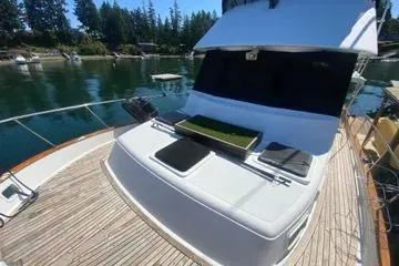 Slide: The Image of 1982 C @ L Sea Ranger yacht docked in a serene marina setting. - 21