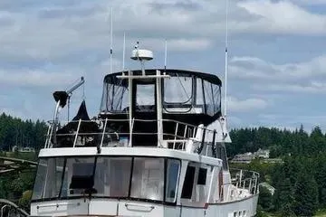 Slide: The Image of 1982 C @ L Sea Ranger boat docked with scenic forest backdrop. - 22