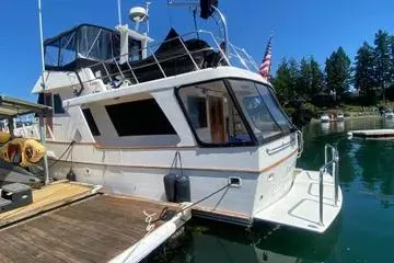 Slide: The Image of 1982 C @ L Sea Ranger boat docked in a serene marina setting. - 25