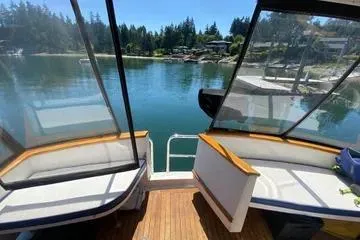 Slide: The Image of 1982 C @ L Sea Ranger boat interior with scenic lake view and surrounding trees. - 32