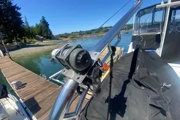 Slide: The Image of 1982 C @ L Sea Ranger boat docked by a scenic waterfront. - 34