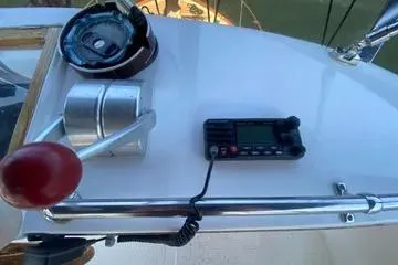 Slide: The Image of Control panel of a 1982 C @ L Sea Ranger boat with throttle and radio. - 39
