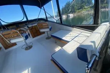Slide: The Image of 1982 C @ L Sea Ranger boat interior with seating and scenic water view. - 41
