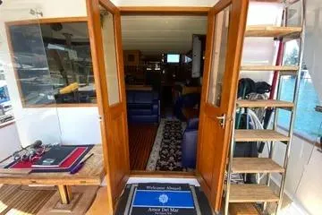 Slide: The Image of 1982 C @ L Sea Ranger yacht interior with wooden doors and nautical decor. - 50