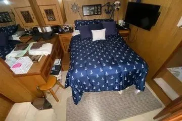 Slide: The Image of Cozy bedroom in 1982 C @ L Sea Ranger yacht with nautical-themed bedding. - 57