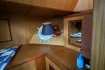Slide: The Image of 1982 C @ L Sea Ranger interior with wooden paneling and nautical decor. - 61