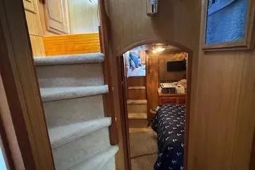 Slide: The Image of Interior of 1982 C @ L Sea Ranger boat with cozy cabin and carpeted stairs. - 63