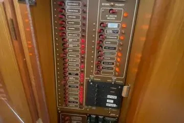 Slide: The Image of Electrical panel on a 1982 C @ L Sea Ranger boat, featuring labeled switches and indicators. - 64