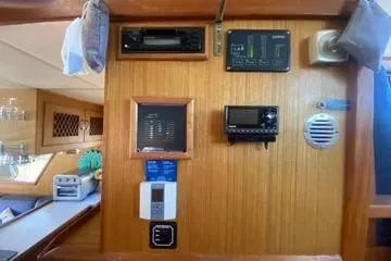 Slide: The Image of 1982 C @ L Sea Ranger interior with navigation instruments and wooden paneling. - 66