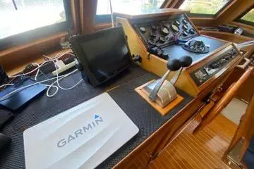 Slide: The Image of 1982 C @ L Sea Ranger cockpit with Garmin navigation system and control panel. - 68