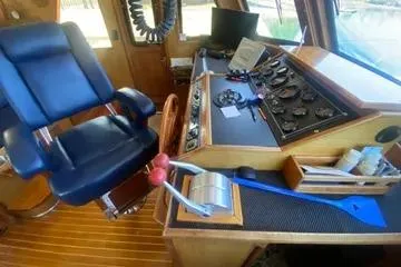 Slide: The Image of 1982 C @ L Sea Ranger helm with control panel and captain's chair. - 69