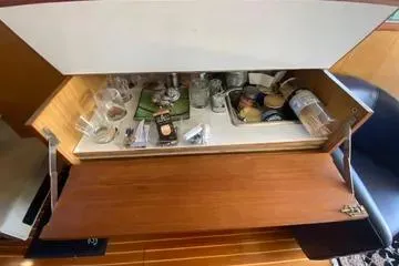 Slide: The Image of 1982 C @ L Sea Ranger interior bar with glasses and bottles. - 81