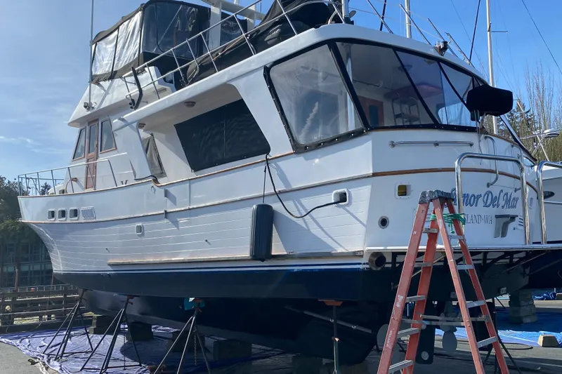 Slide: The Image of 1982 C & L Sea Ranger yacht on dry dock with ladder and clear sky. - 9