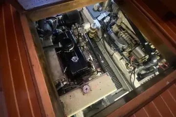 Slide: The Image of Engine compartment of a 1982 C @ L Sea Ranger boat, showcasing mechanical components. - 91