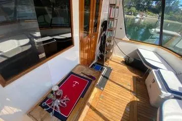 Slide: The Image of 1982 C @ L Sea Ranger boat interior with wooden flooring and nautical decor. - 92