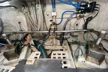 Slide: The Image of Engine room of a 1982 C @ L Sea Ranger boat with visible wiring and components. - 94