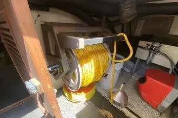 Slide: The Image of 1982 C @ L Sea Ranger interior with hose reel and equipment storage. - 98