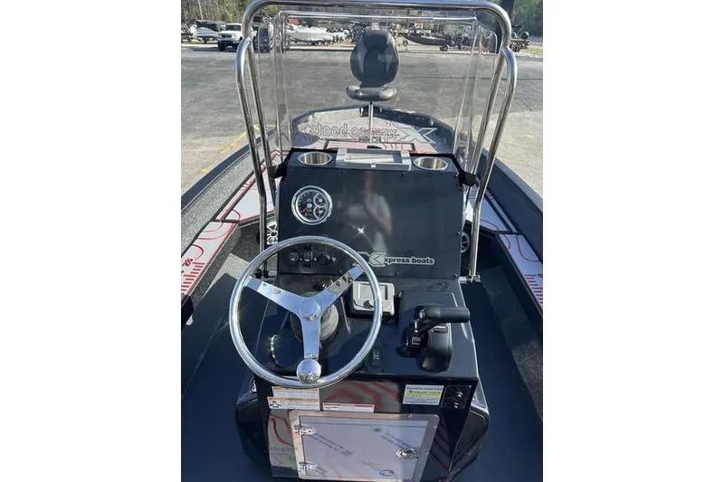 Slide: The Image of 2026 Xpress H22B Bay boat dashboard with steering wheel and controls. - 8