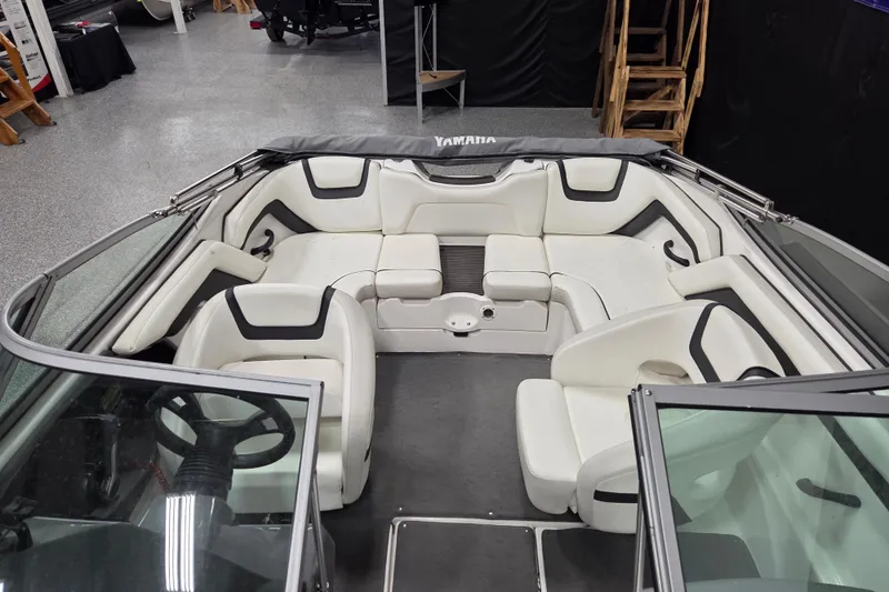 Slide: The Image of 2015 Yamaha Boats SX190 interior with white seating and steering wheel. - 10