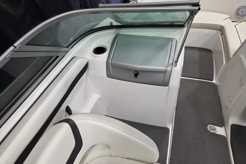 Slide: The Image of 2015 Yamaha Boats SX190 interior with seating and windshield, showcasing sleek design and comfort. - 9