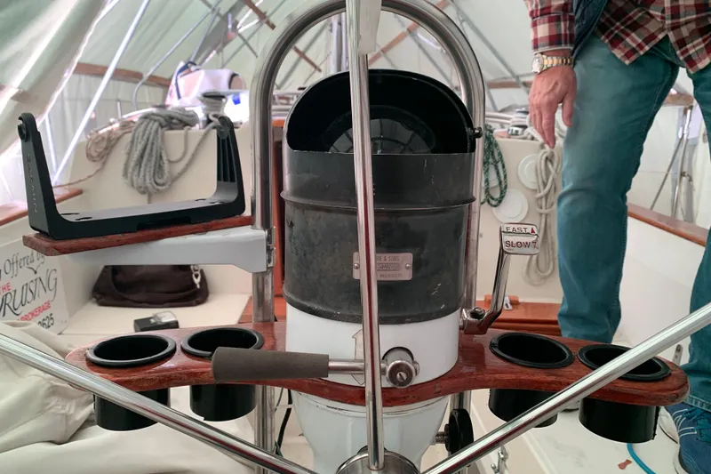 Slide: The Image of Cockpit of a 1984 Sabre 38 sailboat with steering wheel and control panel. - 17