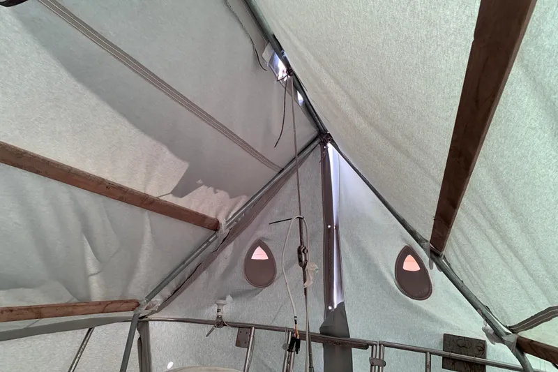 Slide: The Image of Interior view of a 1984 Sabre 38 sailboat under a protective cover. - 18
