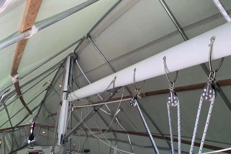 Slide: The Image of Interior view of a 1984 Sabre 38 sailboat mast and rigging under a protective cover. - 20