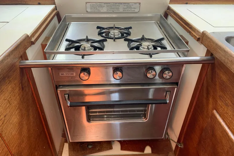 Slide: The Image of Stainless steel gas stove and oven in 1984 Sabre 38 yacht kitchen. - 29