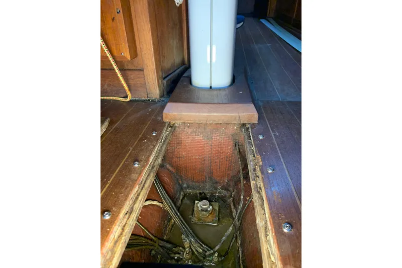 Slide: The Image of Interior view of 1984 Sabre 38 sailboat, showing wooden flooring and structural details. - 31