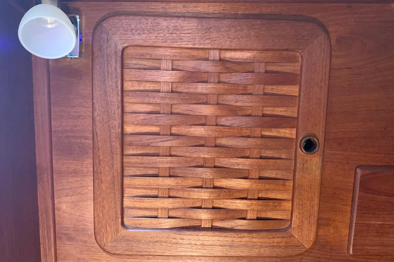 Slide: The Image of Wooden lattice panel on 1984 Sabre 38 boat interior with adjacent light fixture. - 34
