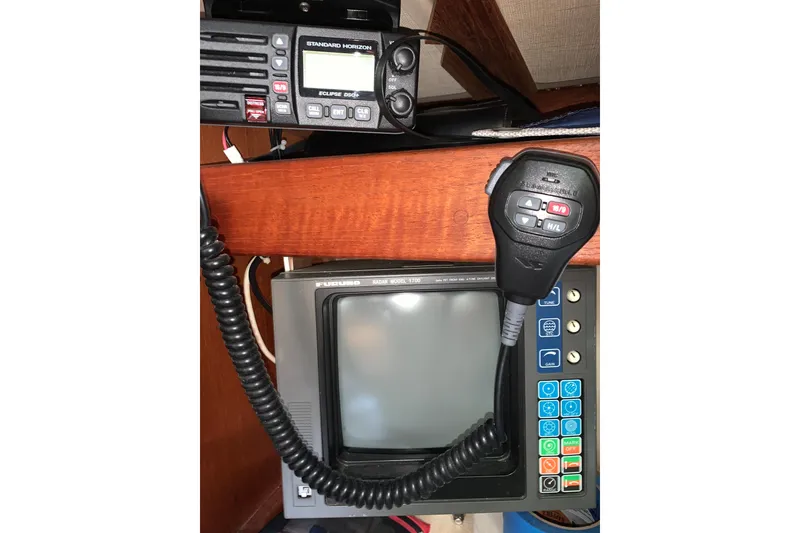 Slide: The Image of 1984 Sabre 38 yacht navigation equipment with radio and display panel. - 56