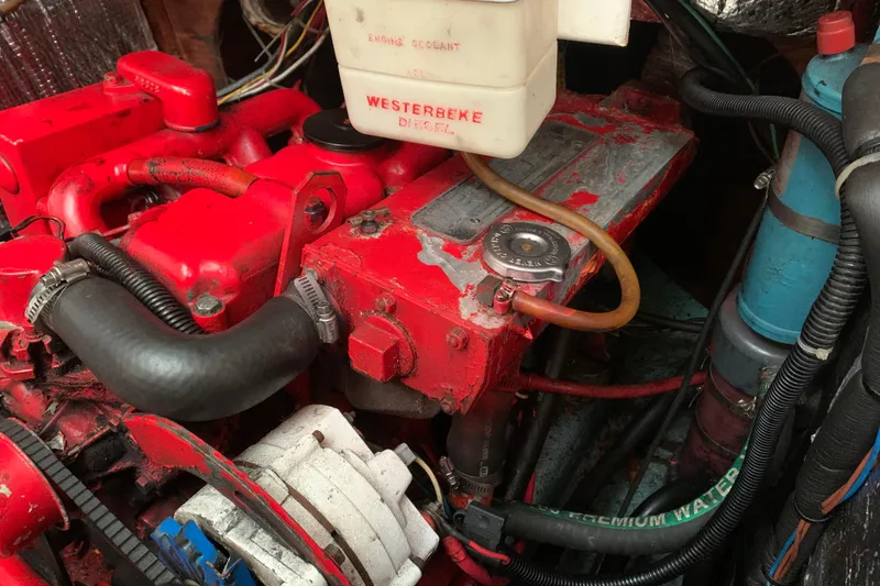 Slide: The Image of Engine compartment of a 1984 Sabre 38 with a red Westerbeke diesel engine. - 57