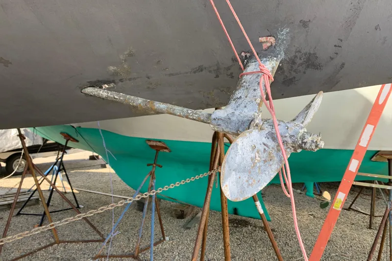 Slide: The Image of Propeller of a 1984 Sabre 38 sailboat on stands, showing wear and maintenance setup. - 8