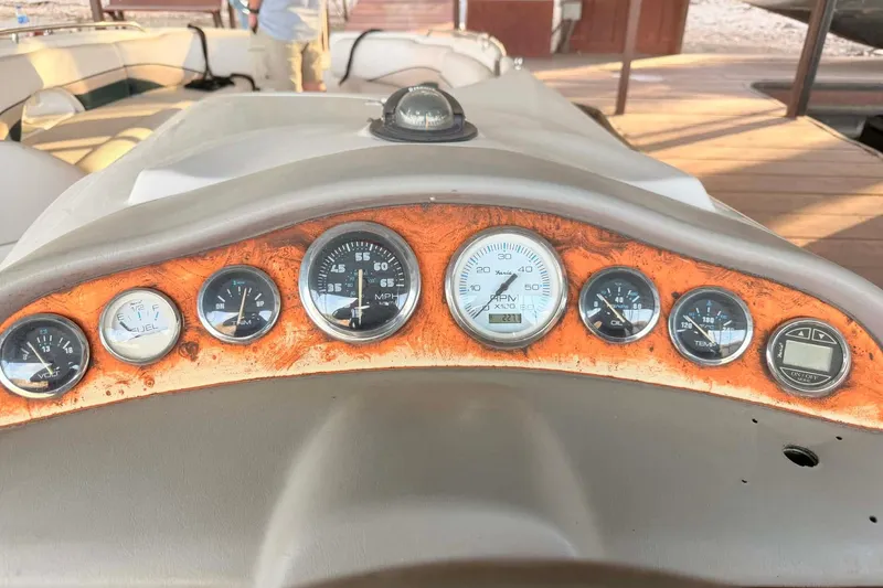 Slide: The Image of Dashboard of a 1998 Chaparral Sunesta 252 boat with various gauges and controls. - 17