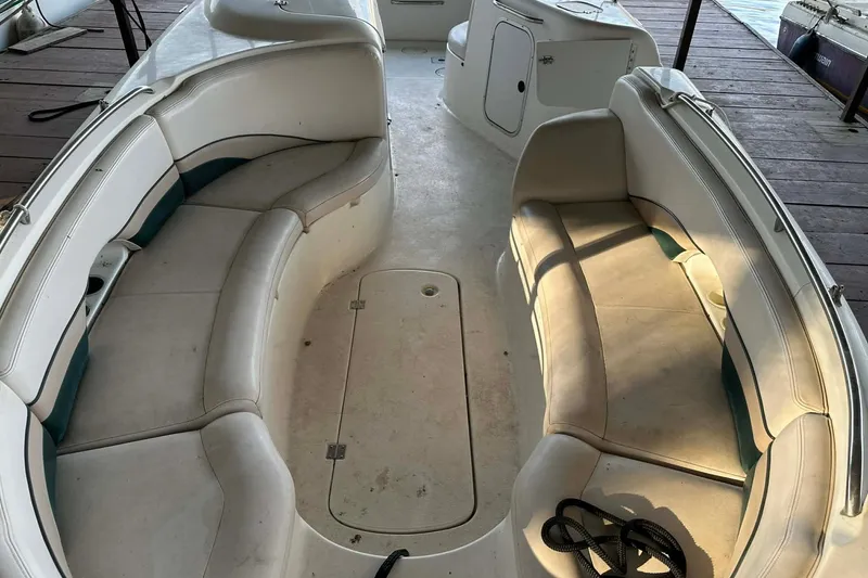 Slide: The Image of 1998 Chaparral Sunesta 252 boat interior with spacious seating and storage compartments. - 4