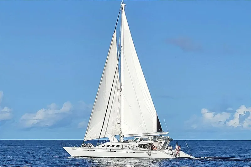 The Image of Sailing yacht Kelsall Manannan Custom 1988 on open sea under clear blue sky. - 0