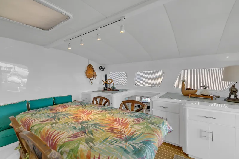 Slide: The Image of Interior of 1988 Kelsall Manannan Custom yacht with tropical decor and wooden furniture. - 14