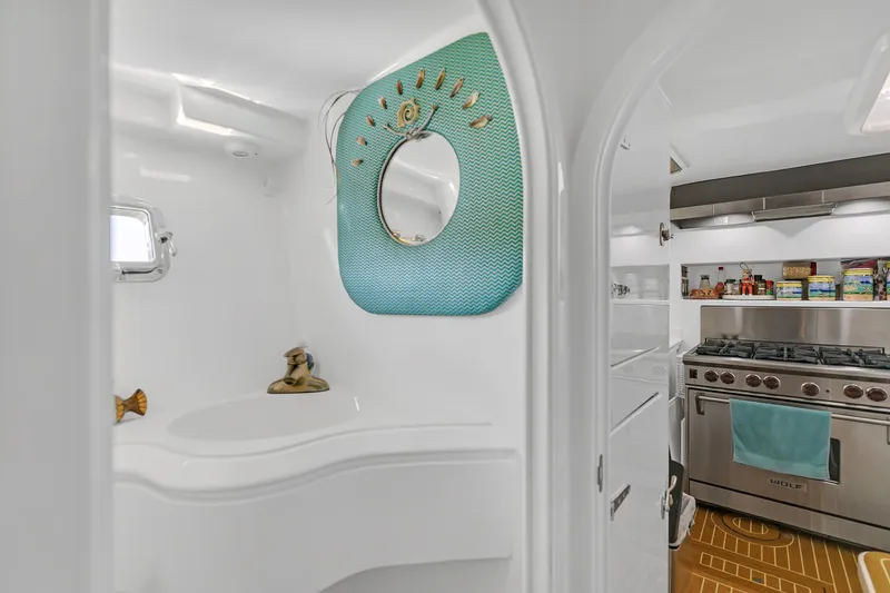 Slide: The Image of Luxurious 1988 Kelsall Manannan Custom yacht interior with modern kitchen and stylish bathroom. - 16